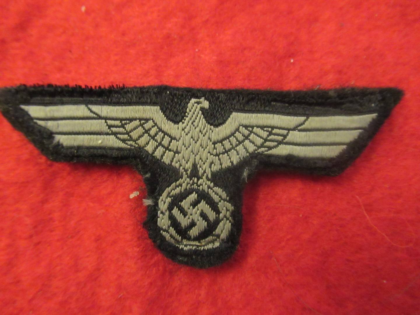 Panzer overseas cap on piece of tunic